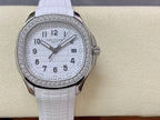 Diamond bezel watch with white dial and white textured rubber strap, centered front view