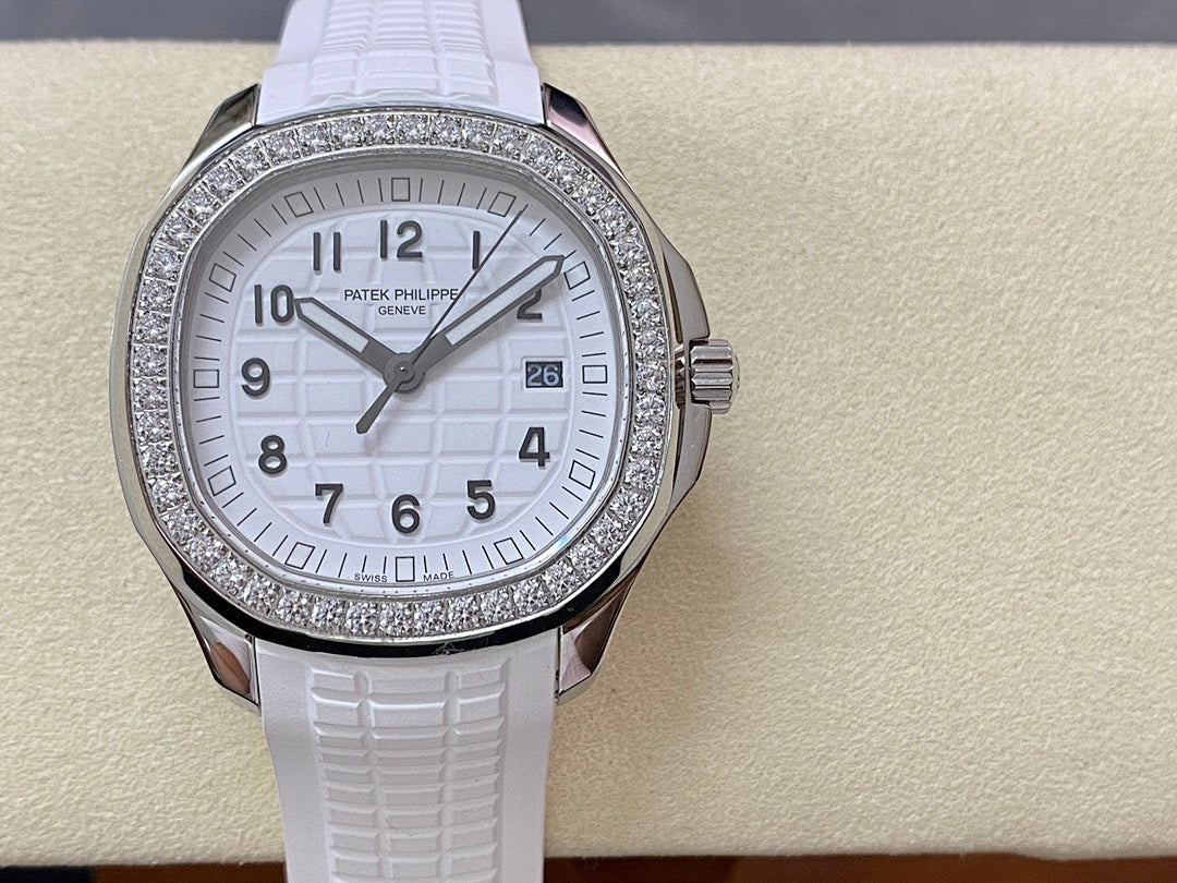 Diamond bezel watch with white dial and white textured rubber strap, centered front view