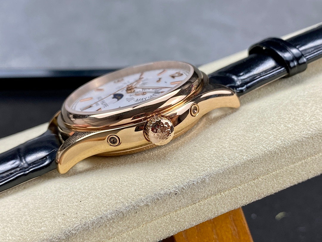 Patek Philippe watch side view with crown and rose-gold case on black leather strap