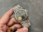 Stainless steel wristwatch with gray dial, baton markers, and metal bracelet