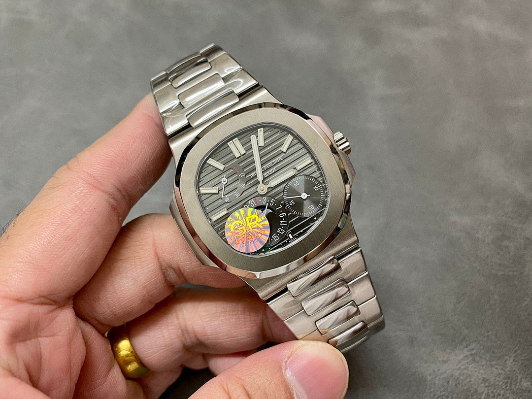 Stainless steel wristwatch with gray dial, baton markers, and metal bracelet