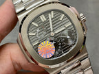 Close-up of stainless steel wristwatch dial with gray stripes and visible subdials