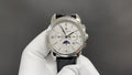 Patek Philippe watch front view with silver dial and black leather strap