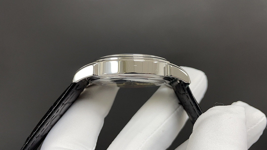 Patek Philippe watch stainless steel bezel with black leather strap