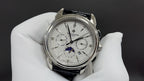 Patek Philippe watch with white dial and black leather strap