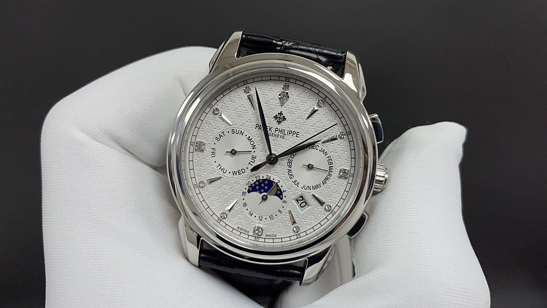 Patek Philippe watch with white dial and black leather strap