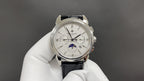 Patek Philippe watch front with silver dial and black leather strap