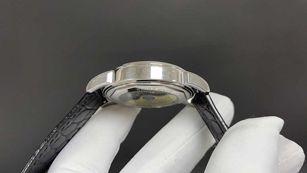 Patek Philippe watch caseback side view with black leather strap