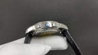 Patek Philippe watch profile with blue accent and black leather strap