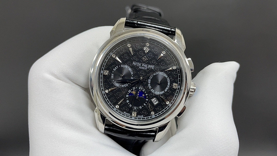 Patek Philippe chronograph watch with black dial and black leather strap, steel case