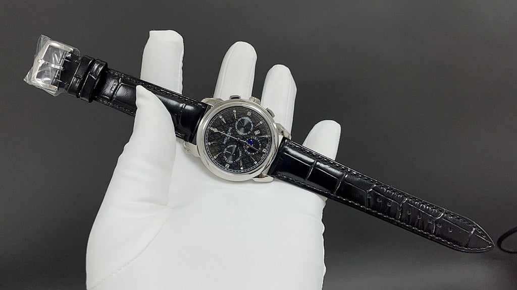 Patek Philippe watch angled view with black leather strap and buckle