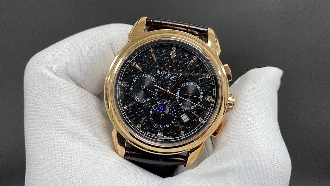 Patek Philippe wristwatch front view, dark dial with subdials, brown leather strap