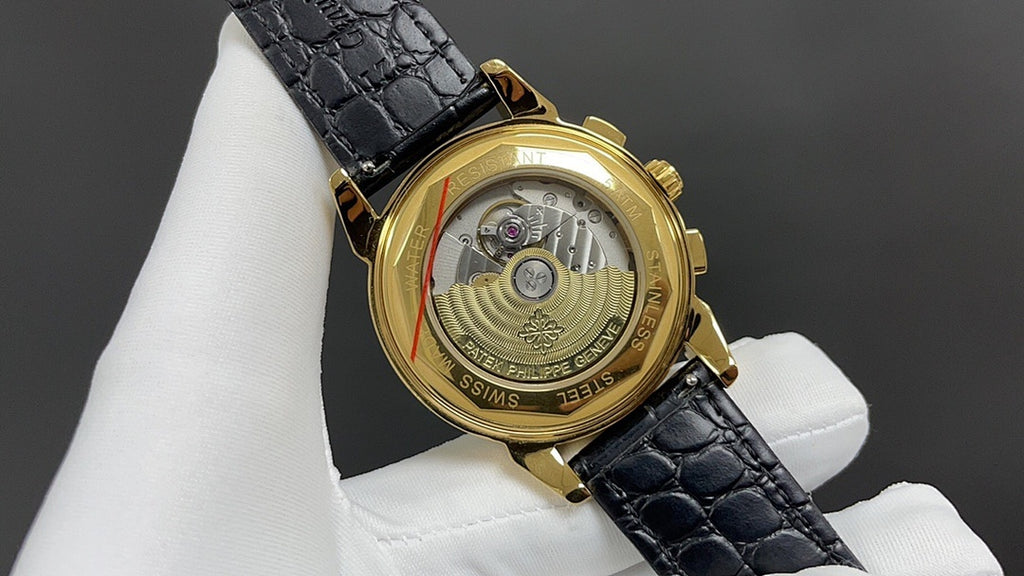 Patek Philippe wristwatch back view with black leather strap and gold case