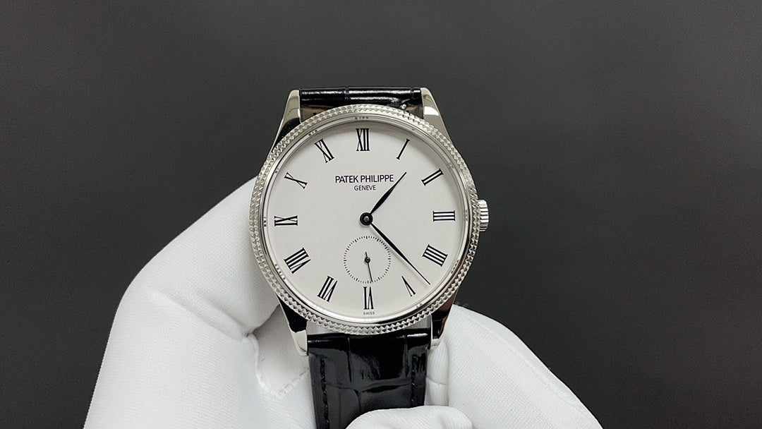 Patek Philippe watch showing white dial and black leather strap with Roman numerals
