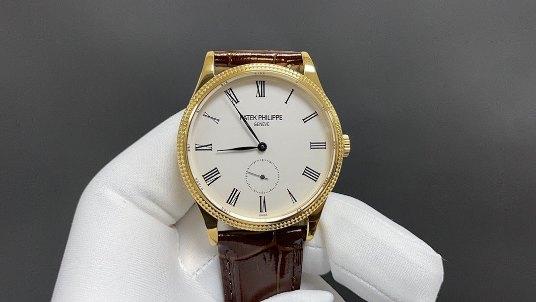 Patek Philippe watch with white dial and black hands, gold case, brown leather strap