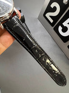 Patek Philippe black leather strap detail with stitching and silver buckle hardware