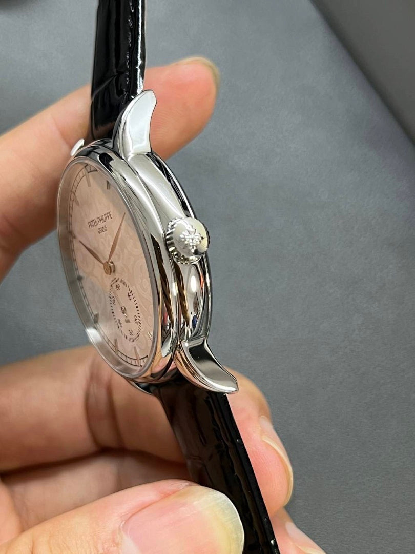 Patek Philippe watch rear view showing polished case back and black leather strap
