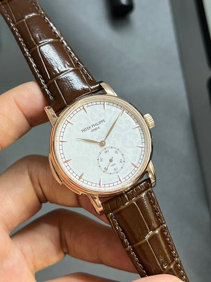 Patek Philippe round wristwatch with white dial, brown leather strap, gold-tone case