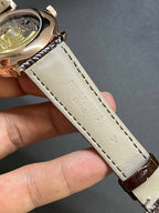 Round wristwatch strap with light-beige lining, brown outer leather, visible stitching