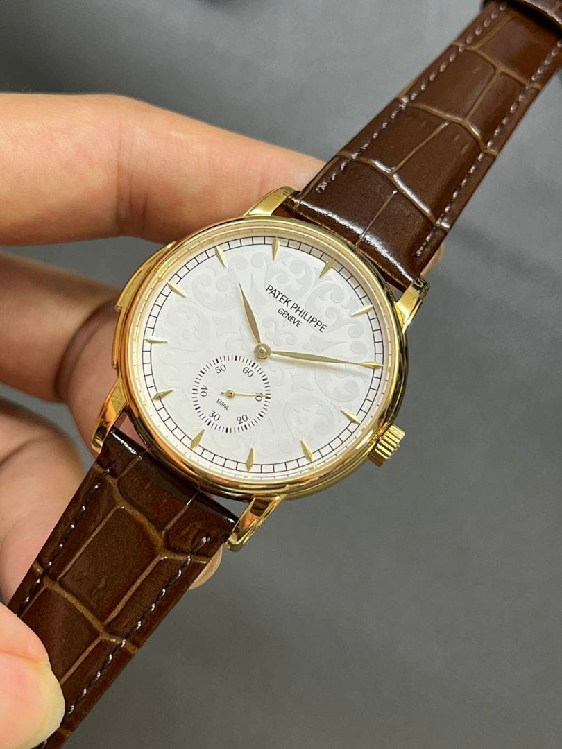 Patek Philippe wristwatch, brown leather strap, gold case, white dial close-up
