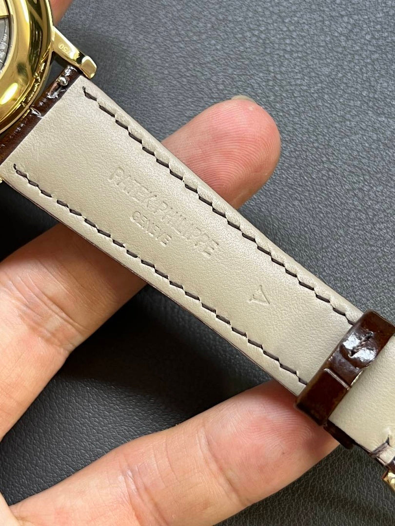 Patek Philippe watch strap, brown leather with pale stitching and gold tang