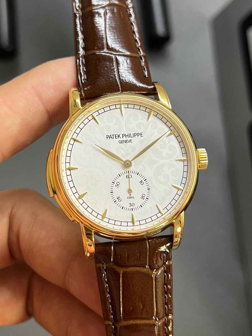 Patek Philippe wristwatch, front view, brown leather strap, gold case, white dial