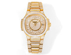 Patek Philippe gold-tone wristwatch with diamond bezel, textured dial, and link bracelet