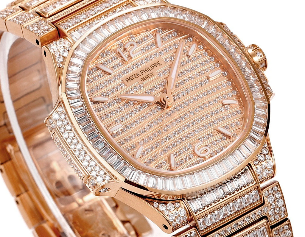 Rose gold diamond wristwatch close-up of dial and bezel with sparkling hour markers
