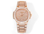 Rose gold diamond bezel wristwatch with textured dial and jeweled link bracelet