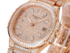 Patek Philippe diamond rose gold watch, close-up of sunburst dial and jeweled bezel