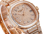 Patek Philippe diamond rose gold watch with jeweled bezel and textured dial view