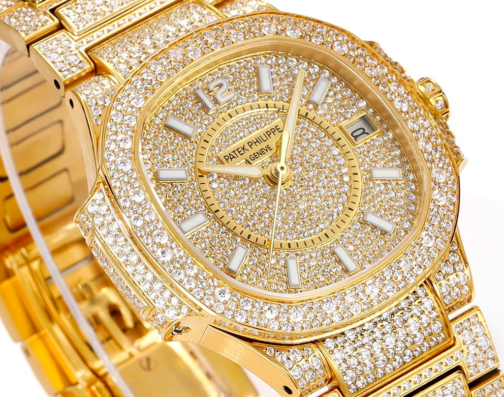 Patek Philippe diamond watch dial with gold hands and hour marks, gemstone set