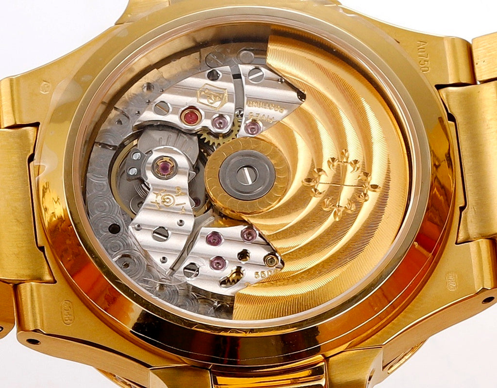 Patek Philippe watch caseback with visible mechanical movement, gold-toned rear