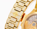 Patek Philippe gold watch bracelet with diamond-set links and engraved center panels