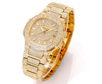 Patek Philippe diamond watch with gold bracelet, round dial and gem-set bezel