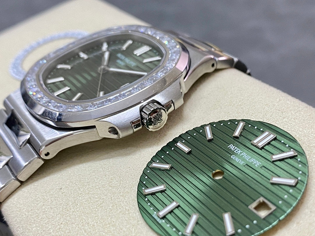 Patek Philippe steel wristwatch with green dial, diamond bezel detail, and crown