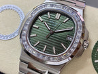 Patek Philippe steel wristwatch with green dial, silver indices, and diamond bezel