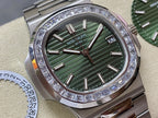 Patek Philippe steel wristwatch close-up with green striped dial and diamond bezel