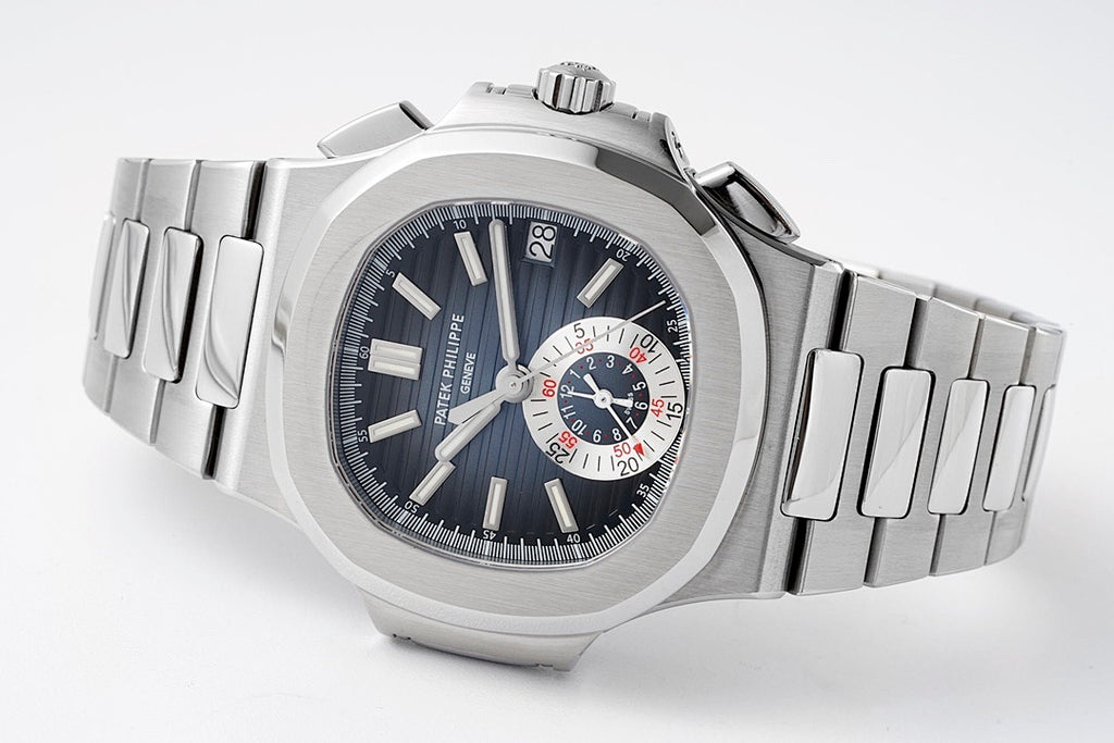 Patek Philippe wristwatch angled view with dark blue dial, steel bracelet, and subdials