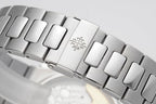 Patek Philippe steel bracelet close-up with clasp and engraved emblem