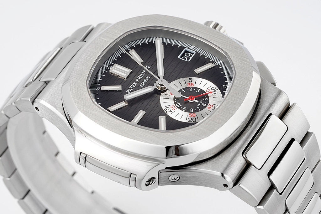 Patek Philippe stainless steel wristwatch with black dial and sporty chronograph layout.