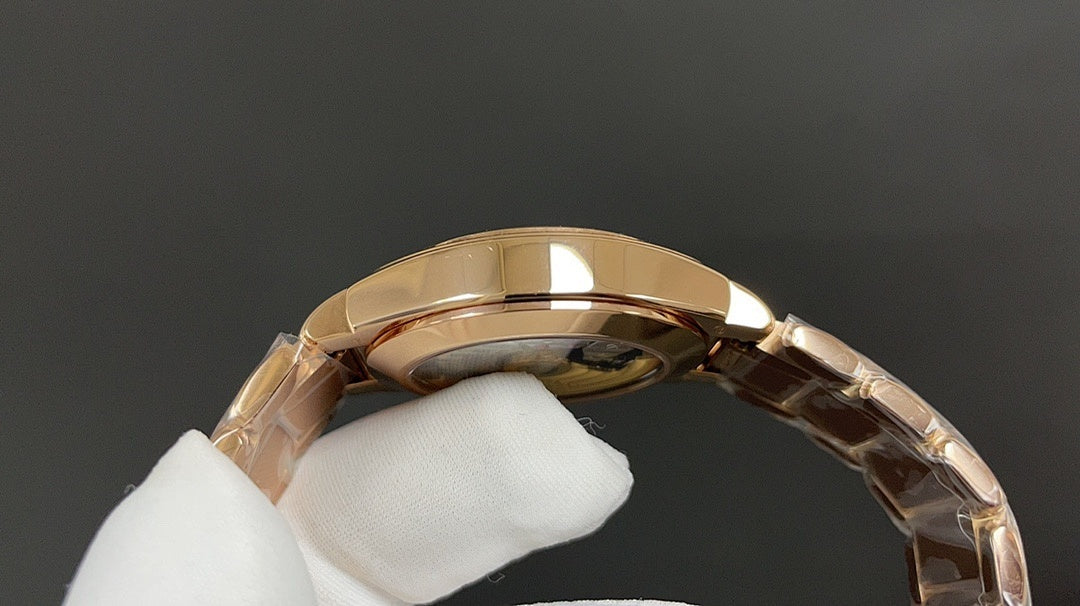 Gold-tone wristwatch back view with metal link bracelet and rounded case