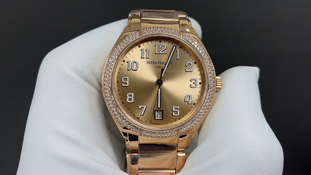 Gold-tone wristwatch with champagne dial, diamond bezel, and metal link bracelet