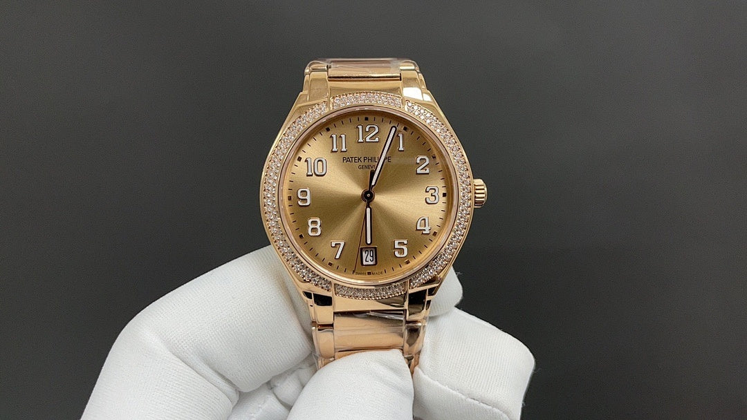 Gold-tone wristwatch front view with champagne dial, diamond bezel, metal bracelet