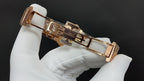 Gold-tone Patek Philippe watch with hinged clasp and rectangular bracelet links