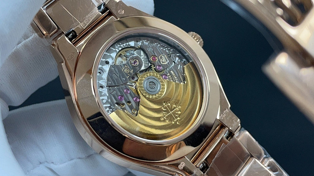 Patek Philippe watch caseback with visible mechanical movement beneath crystal