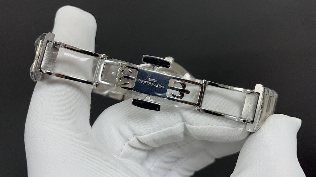 Patek Philippe watch clasp and links, silver metal bracelet.
