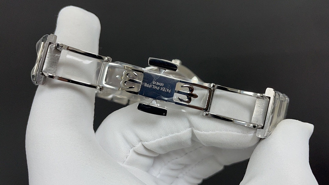 Patek Philippe watch clasp and links, silver metal bracelet.