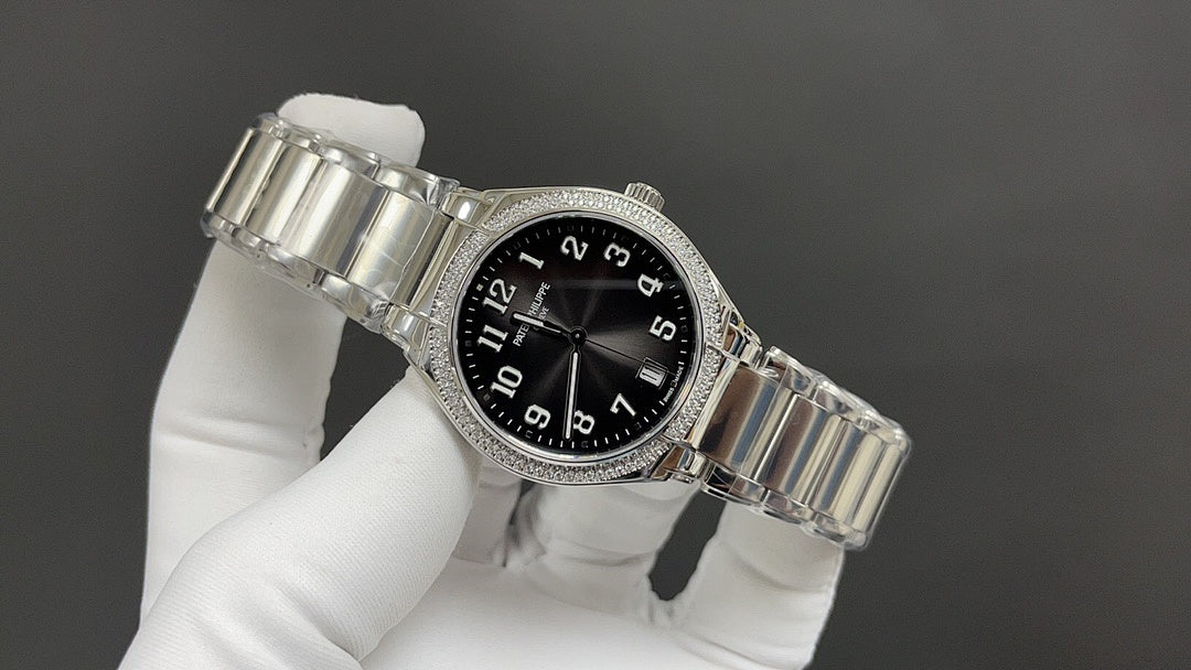 Patek Philippe watch angled view with black dial and silver metal bracelet.
