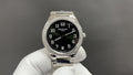 Patek Philippe wristwatch: black dial, silver case, diamond bezel